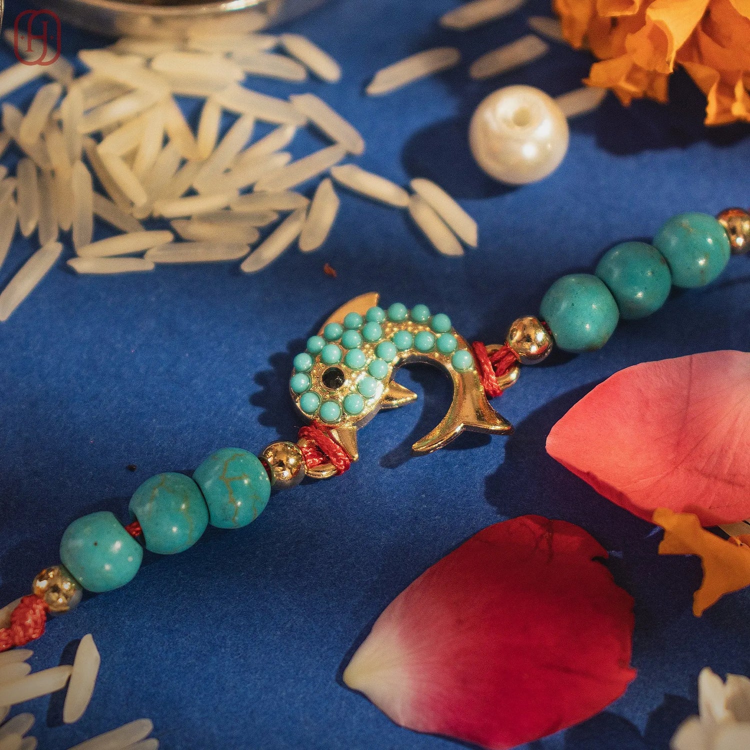 Hardik Jewels Silver Fish Rakhi with Turquoise Beads.
