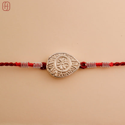 Hardik Jewels Teardrop Rakhi Design with Silver Charm.