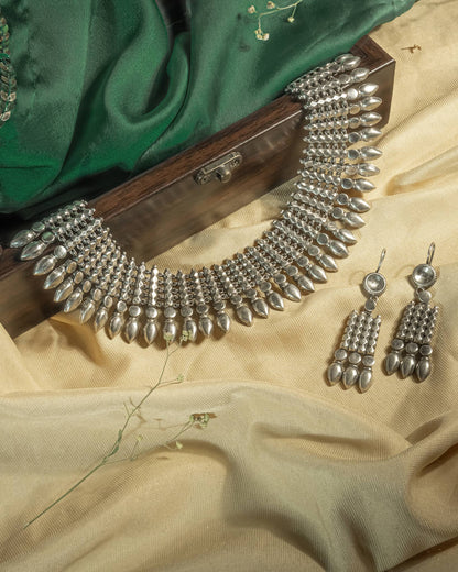 Heavy oxidized 925 sterling silver tribal choker necklace set with matching earrings, featuring geometric spikes and teardrop drops.