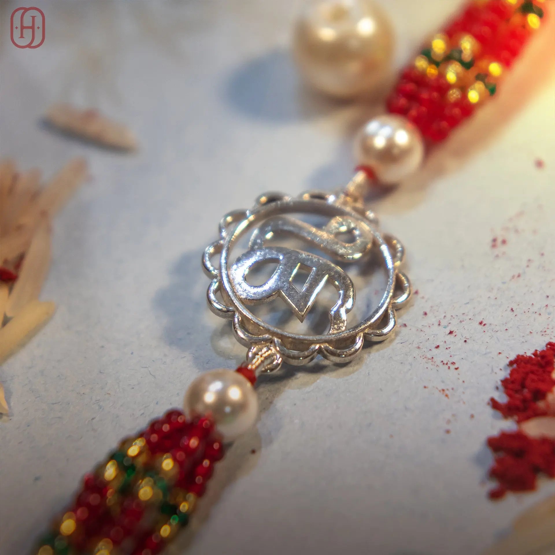 Khanda silver rakhi with scalloped charm and red bead strands - Hardik Jewels