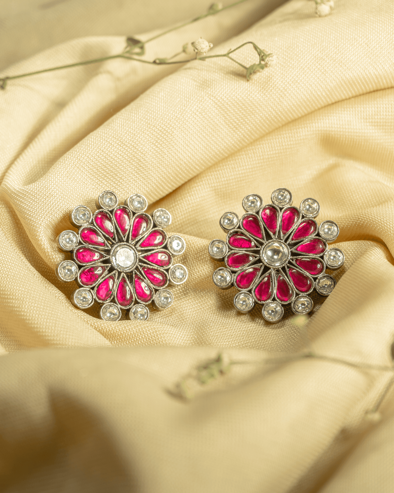 Large 925 sterling silver floral stud earrings featuring ruby pink teardrop stones and white polki style accents.