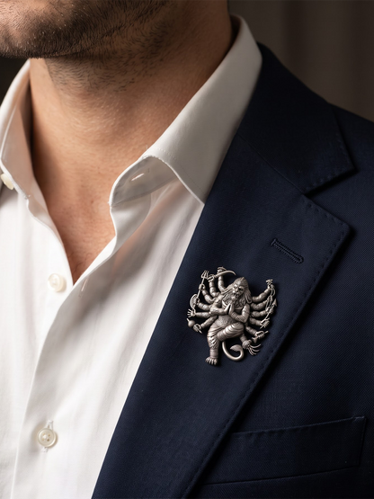 Man wearing silver Narsimha brooch on a blazer