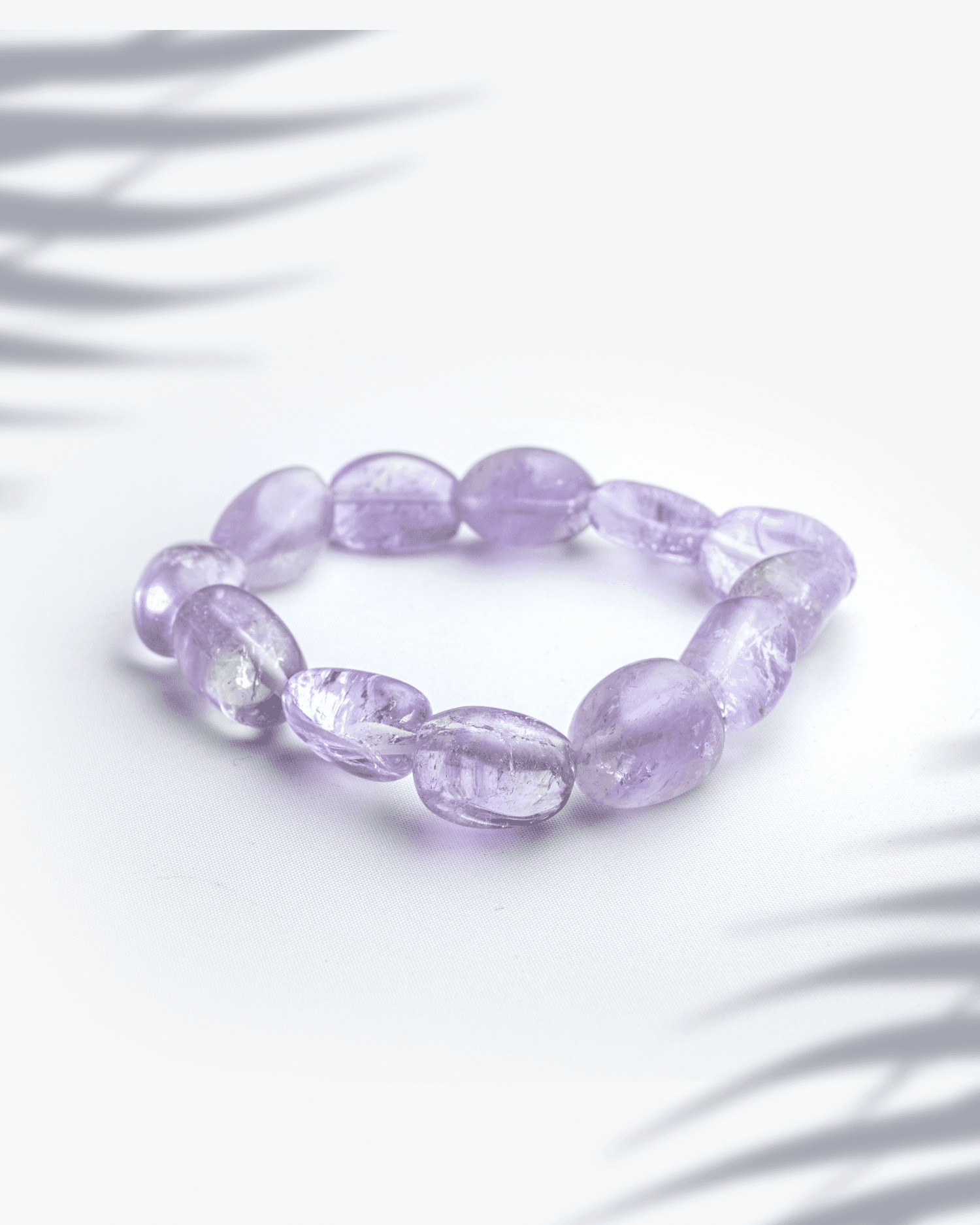 Natural amethyst gemstone bracelet featuring organic tumbled purple nugget beads for peace and spirituality.