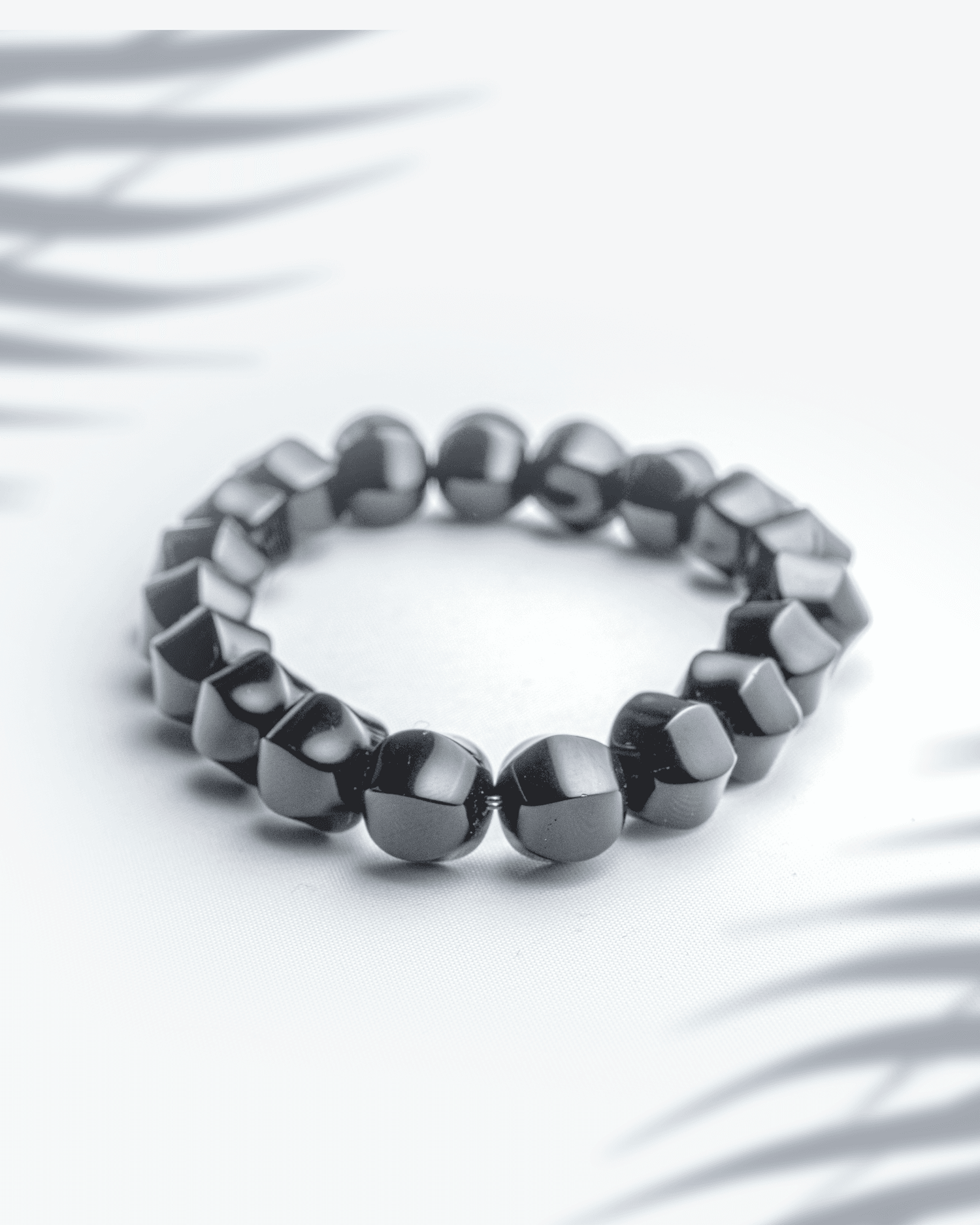 Natural black onyx gemstone bracelet featuring 10mm faceted sparkling beads for protection and strength.