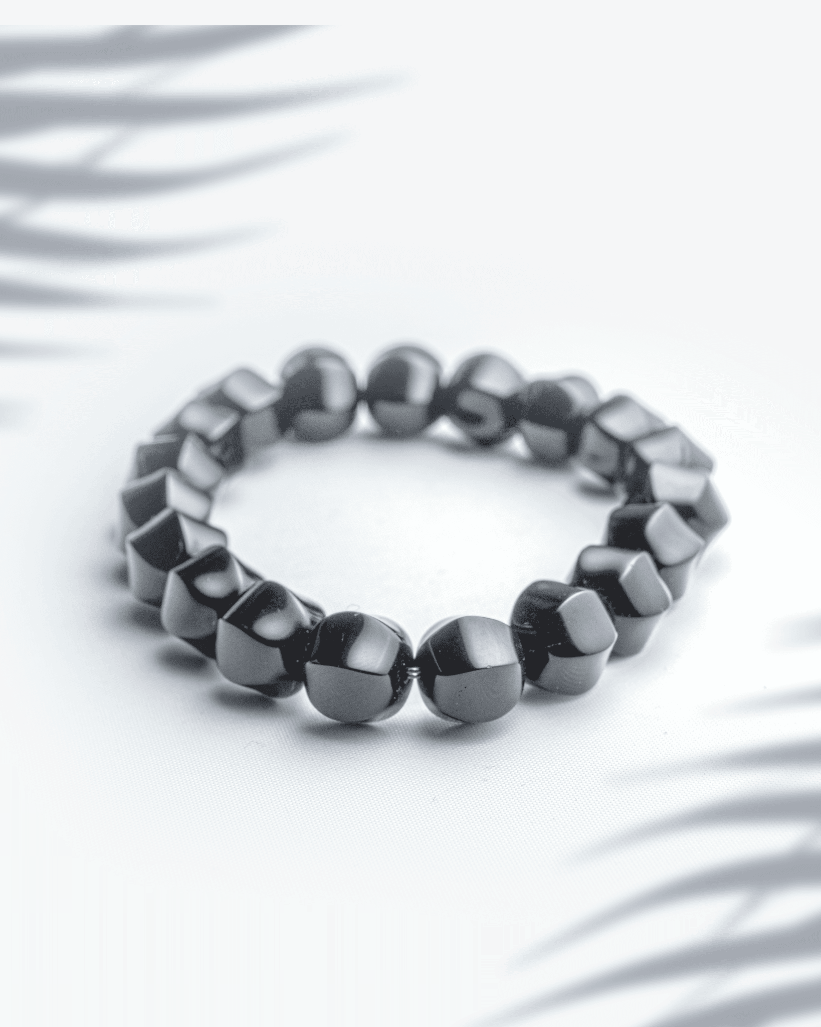 Natural black onyx gemstone bracelet featuring 10mm faceted sparkling beads for protection and strength.