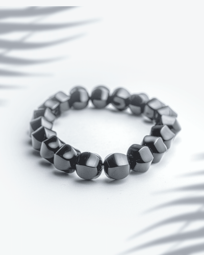 Natural black onyx gemstone bracelet featuring 10mm faceted sparkling beads for protection and strength.