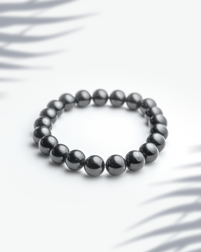 Natural black onyx gemstone bracelet featuring 8mm round glossy beads for strength and protection.