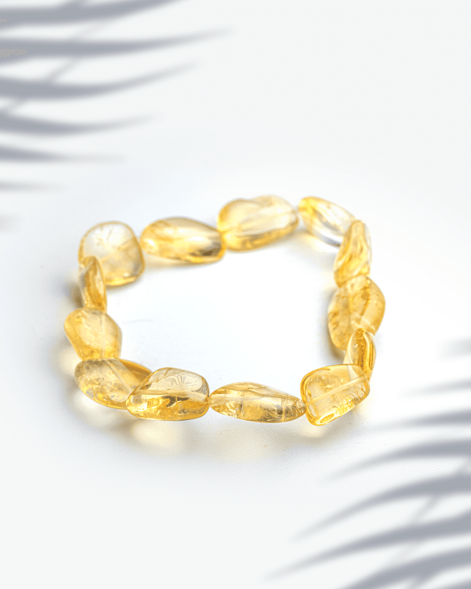 Natural citrine gemstone bracelet featuring organic tumbled yellow nugget beads for wealth and abundance.