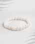 Natural gemstone bracelet featuring a mix of pink Rose Quartz and white Moonstone beads.