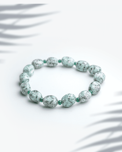 Natural kiwi moonstone bracelet featuring 7mm mint green sesame jasper beads with black speckles.