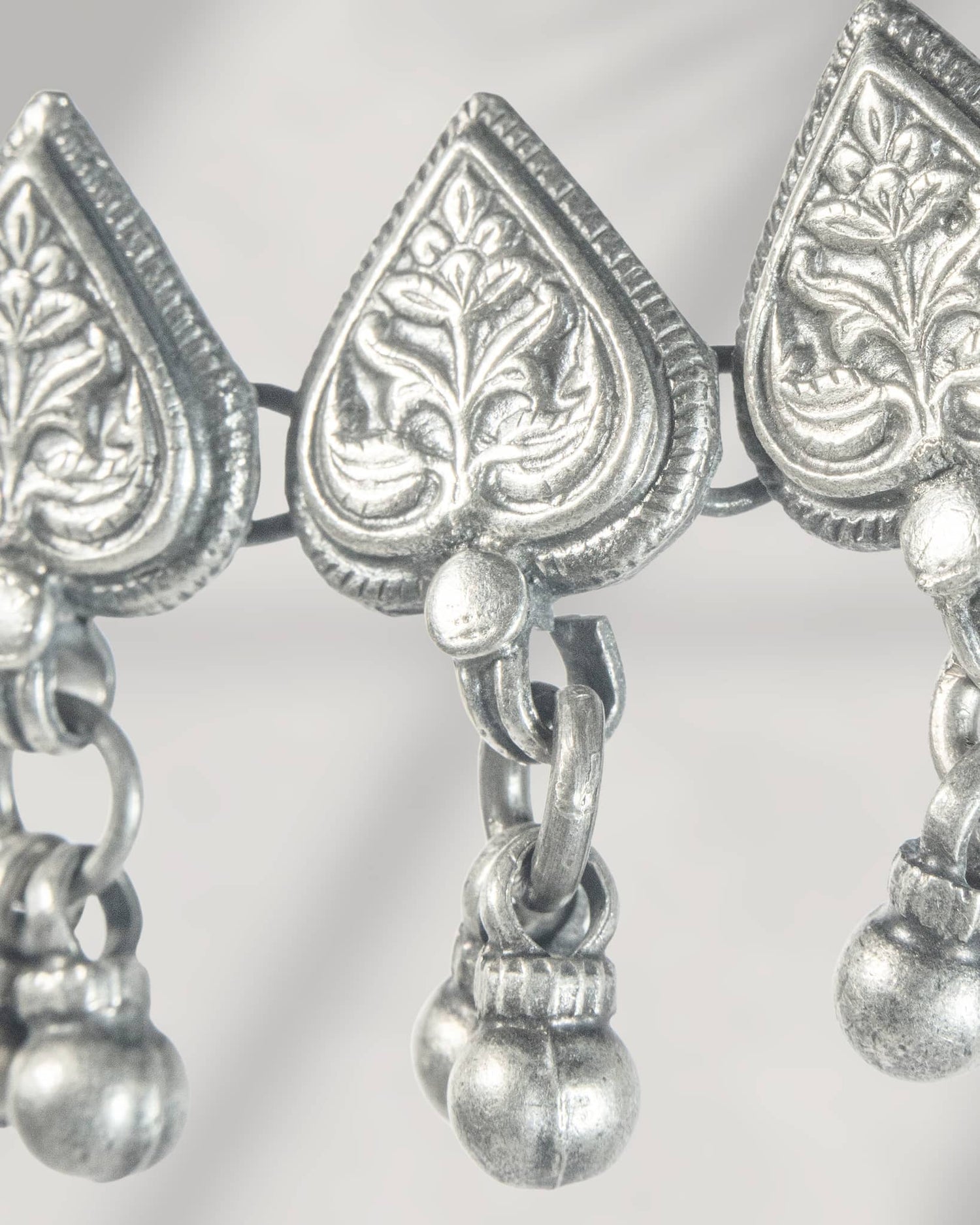 Oxidized 925 sterling silver heart motif choker necklace with ghungroos strung on a black thread, 
