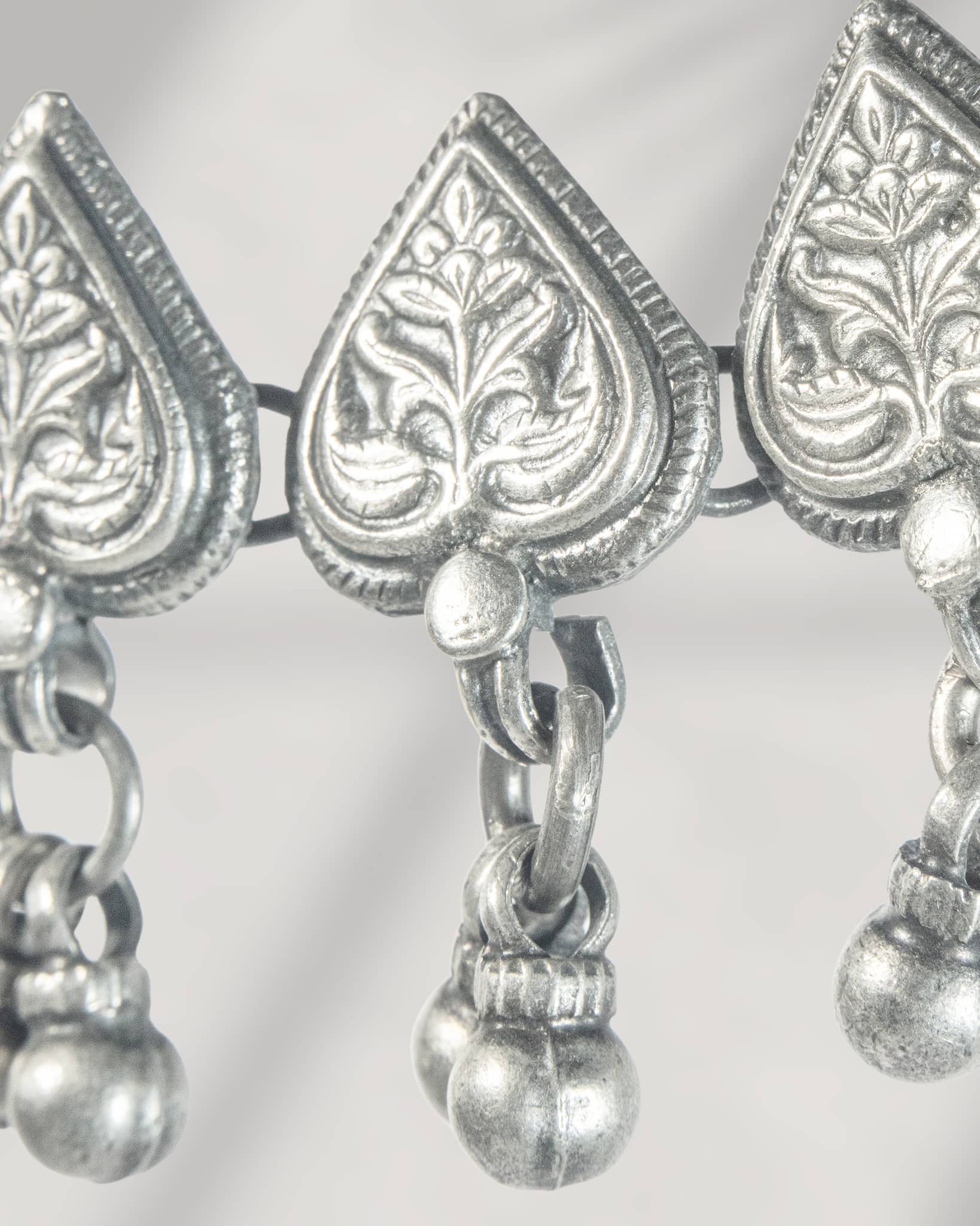 Oxidized 925 sterling silver heart motif choker necklace with ghungroos strung on a black thread, 
