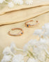 Pair of gold plated 92.5 sterling silver adjustable toe rings featuring an evil eye design with blue stone.