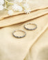 Pair of oxidized 92.5 sterling silver slim band toe rings featuring geometric etched design.