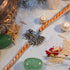 Radha Krishna antique silver rakhi with couple charm on orange thread - Hardik Jewels