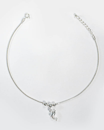 Silver Anklet with a crescent Dolphin charm on a white background