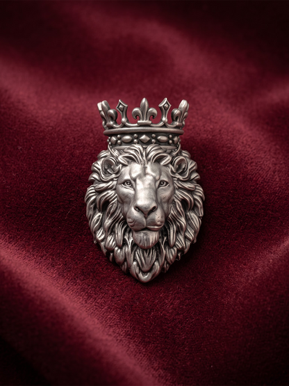 Oxidized 925 silver royal crowned lion brooch on maroon fabric