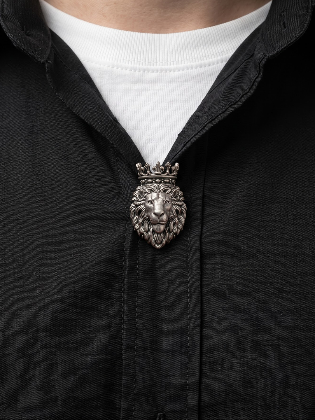 Silver crowned lion button clipped on a shirt for men