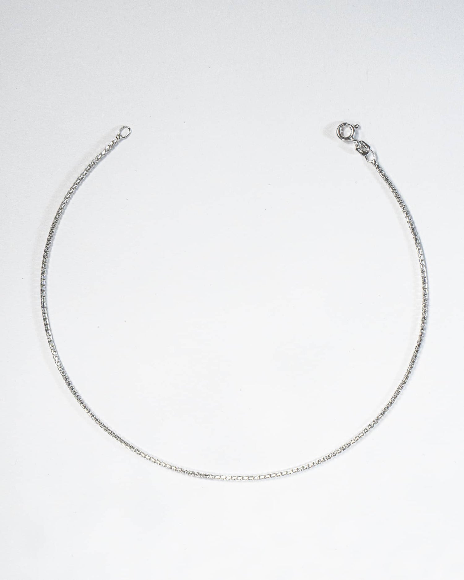 Silver necklace on a white background