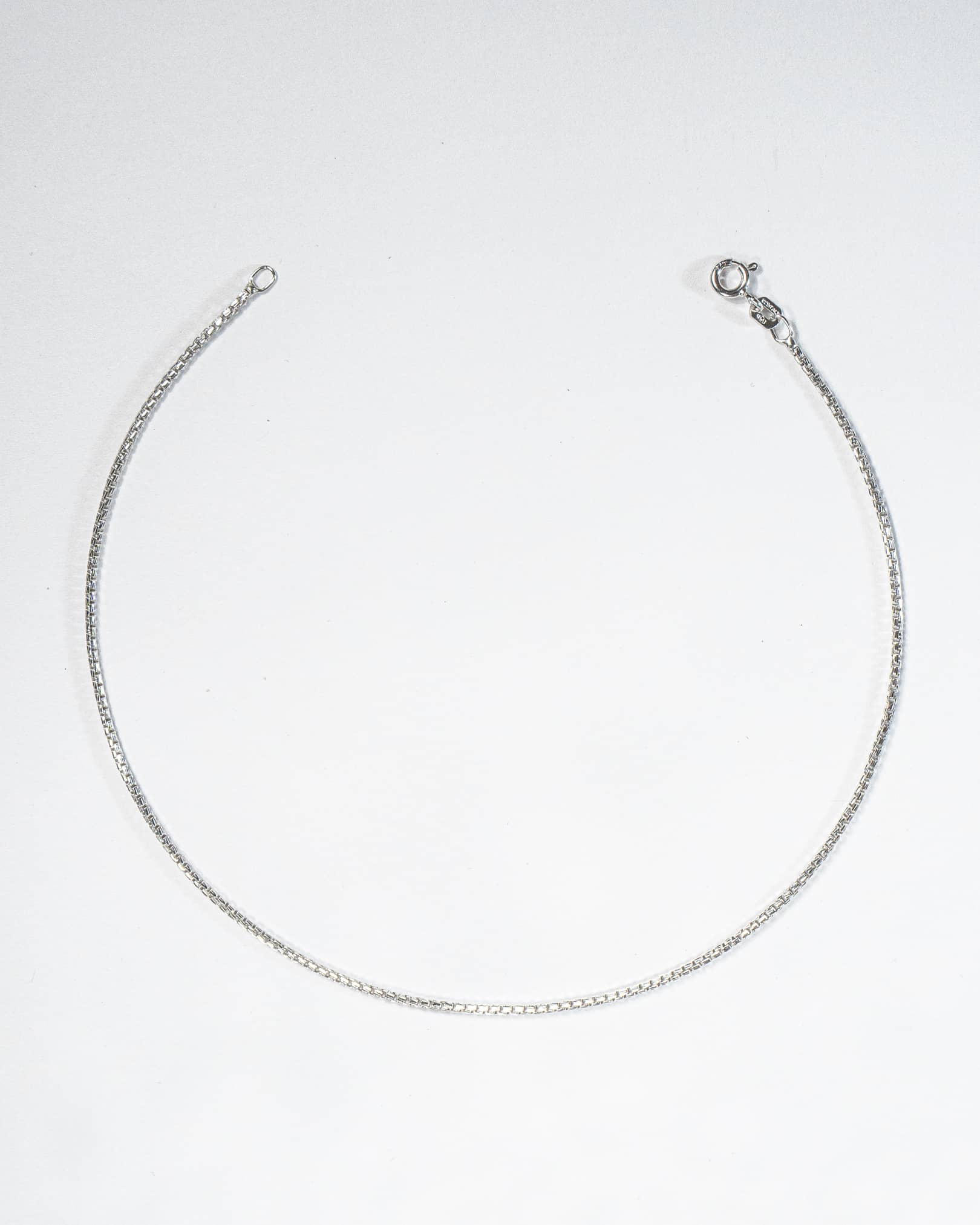 Silver necklace on a white background