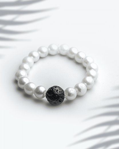 White shell pearl bracelet featuring a single black lava stone bead 9mm contrast jewelry.