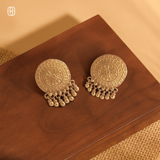Handcrafted mandala earrings in gold tone with intricate detailing and dangling beads