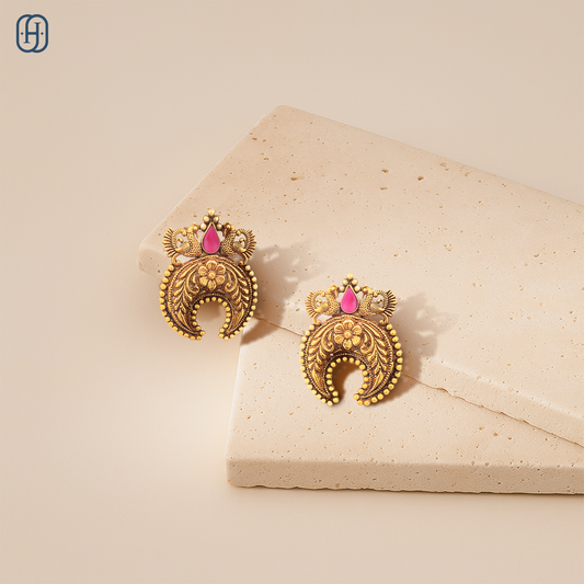 Elegant Peacock Nakkashi earrings with intricate design and pink gemstone accent for festive occasions