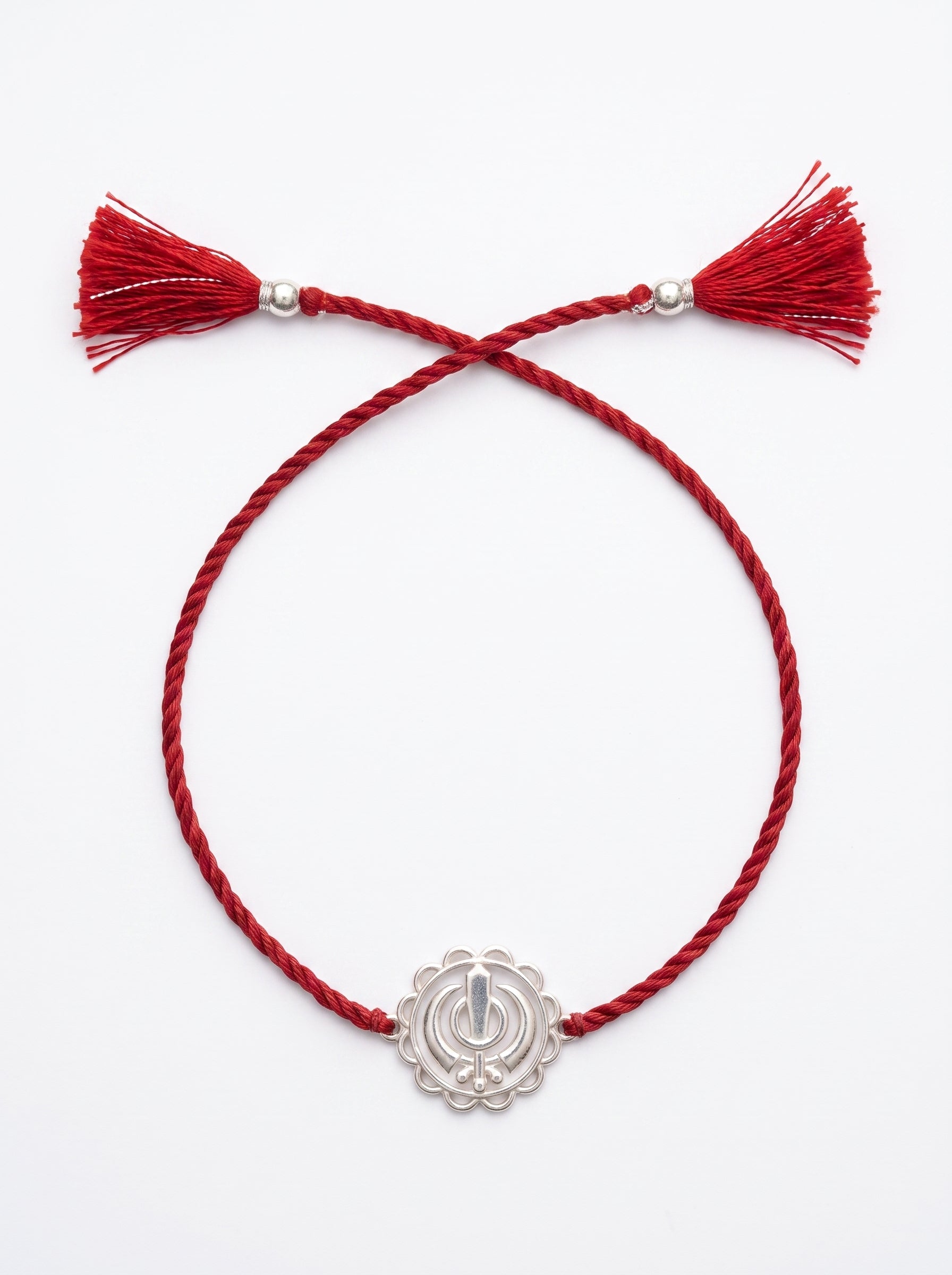 Khanda Silver Rakhi - Red Thread - studio product photo - Hardik Jewels