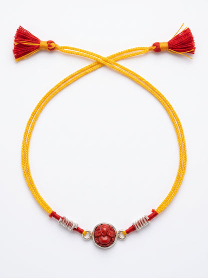 Red Coral Ganesh Ji Silver Rakhi - Yellow - studio product photo - Hardik Jewels