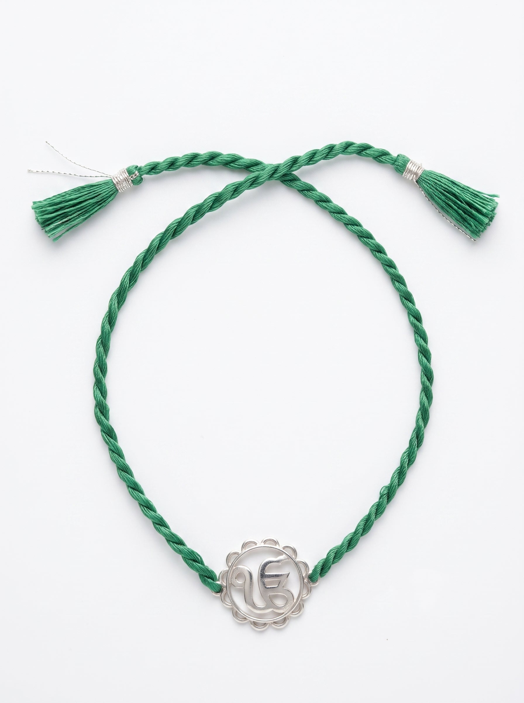 Ik Onkar Silver Rakhi - Green Thread - studio product photo - Hardik Jewels
