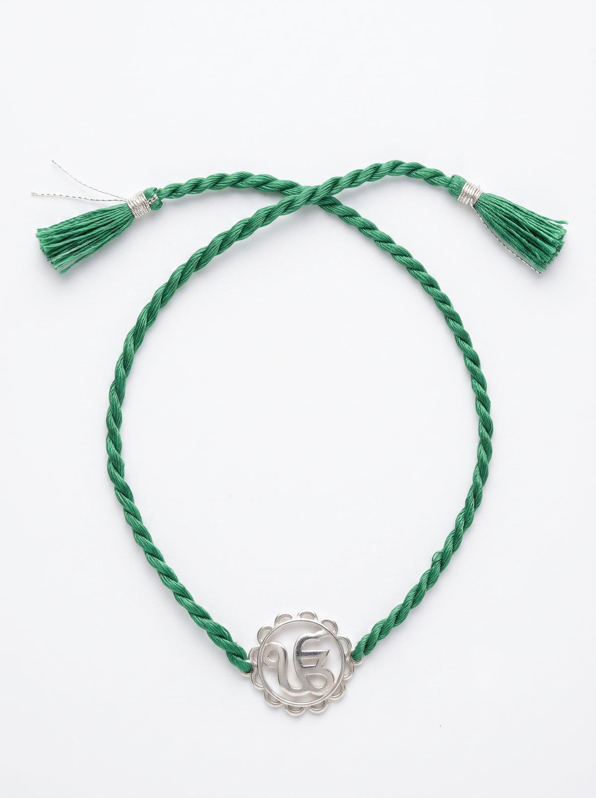Ik Onkar Silver Rakhi - Green Thread - studio product photo - Hardik Jewels