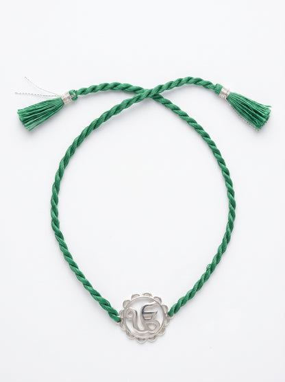 Ik Onkar Silver Rakhi - Green Thread - studio product photo - Hardik Jewels