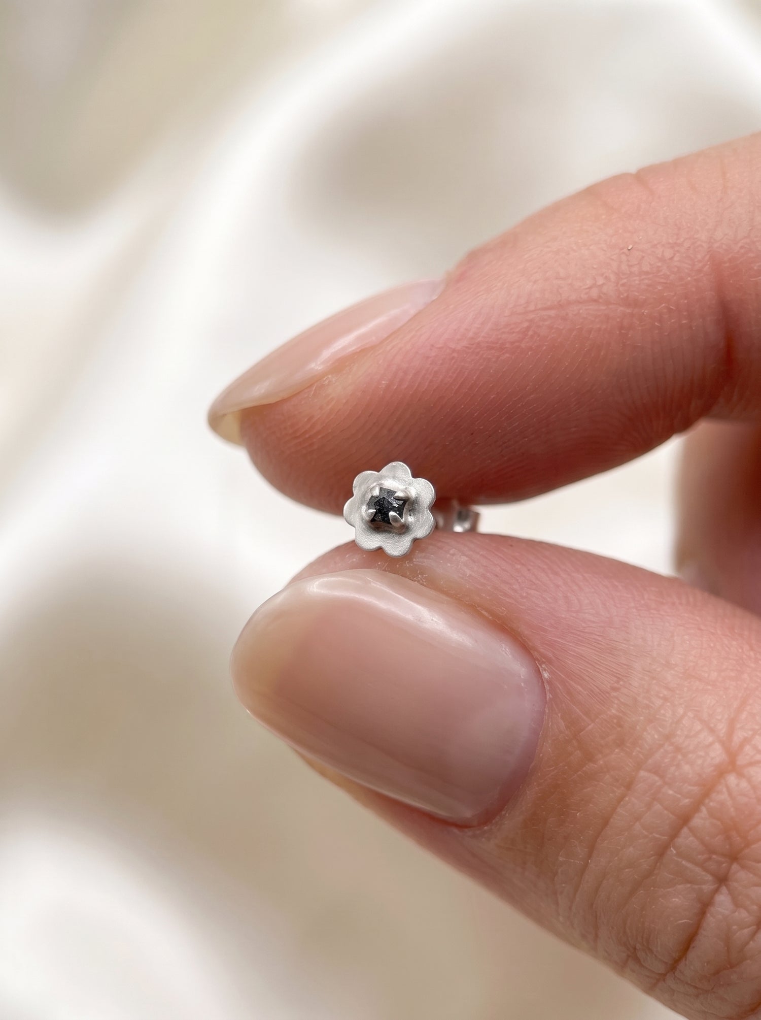 Black Enamel Flower Silver Stud Earrings - close-up detail view - Hardik Jewels