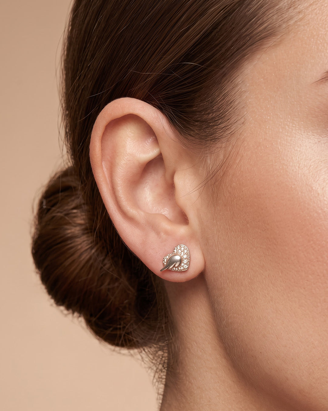 Mother of Pearl Heart Wing CZ Silver Stud Earrings - ear styling view - Hardik Jewels