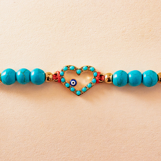 Hardik Jewels Heart Evil Eye Silver Rakhi with Blue Beads.