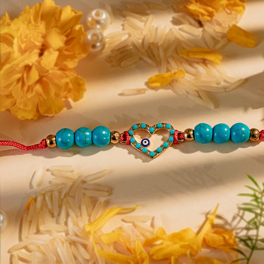 Hardik Jewels Heart Evil Eye Silver Rakhi with Blue Beads.