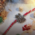 Radha Krishna 92.5 silver rakhi with ornate couple charm - Hardik Jewels
