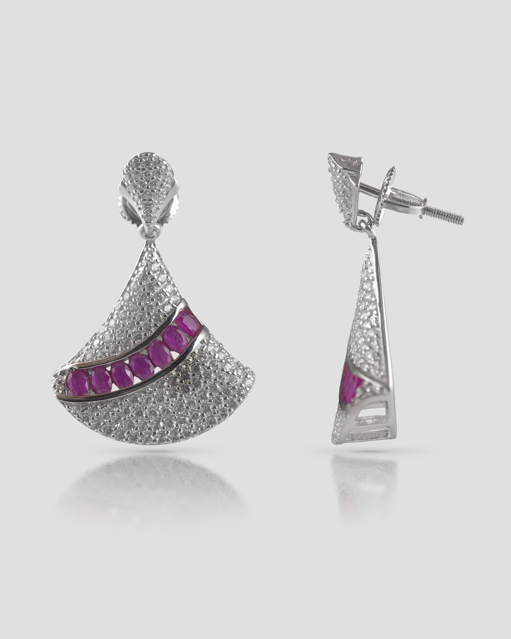 Floating view of silver cz fan drop earrings showing the threaded post and secure screw back closure.