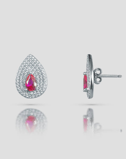Front and side profile view of silver teardrop stud earrings showcasing the pink cz center, clear cz pave surface, and push-back closure.