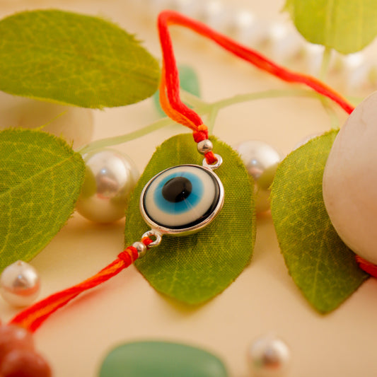 Handcrafted Sterling Silver Evil Eye Rakhi by Hardik Jewels.