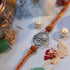 Silver Trishul rakhi with rudraksha beads on orange mauli thread - Hardik Jewels