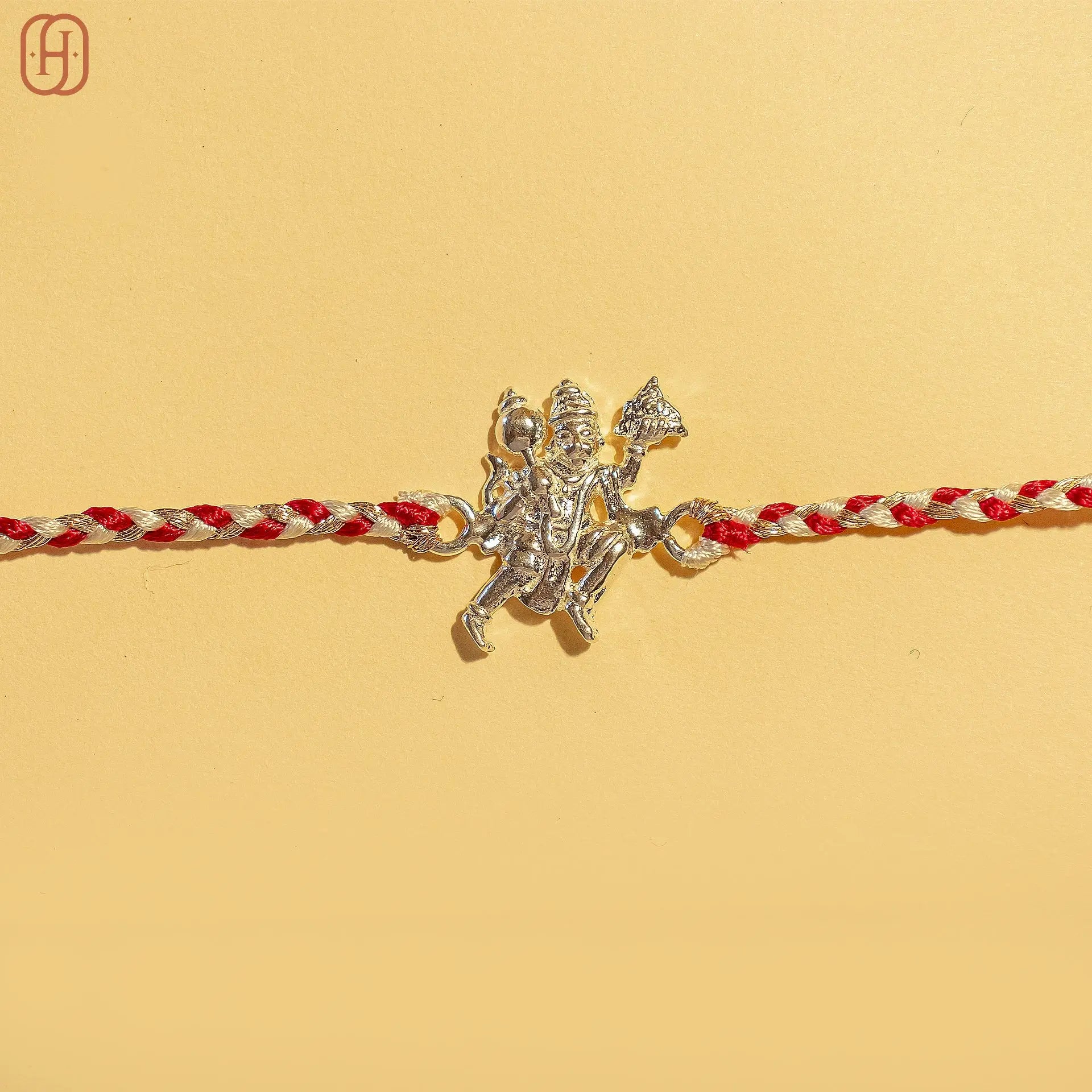Hardik Jewels 92.5 silver hanuman rakhi with intricate Hanuman pendant on red and white braided thread
