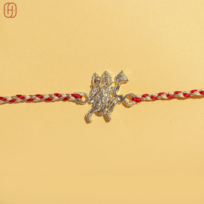 Hardik Jewels 92.5 silver hanuman rakhi with intricate Hanuman pendant on red and white braided thread
